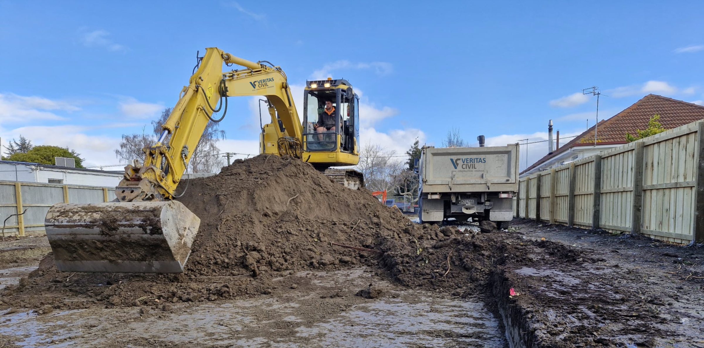 Veritas Civil excavator and truck on a Christchurch site